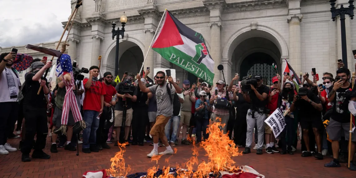 Pro-Palestinian Protesters Burn U.S. Flag During Netanyahu Speech in DC, Paint “Hamas is Coming” as Nearly 100 Democrats Boycott Israeli PM’s Address